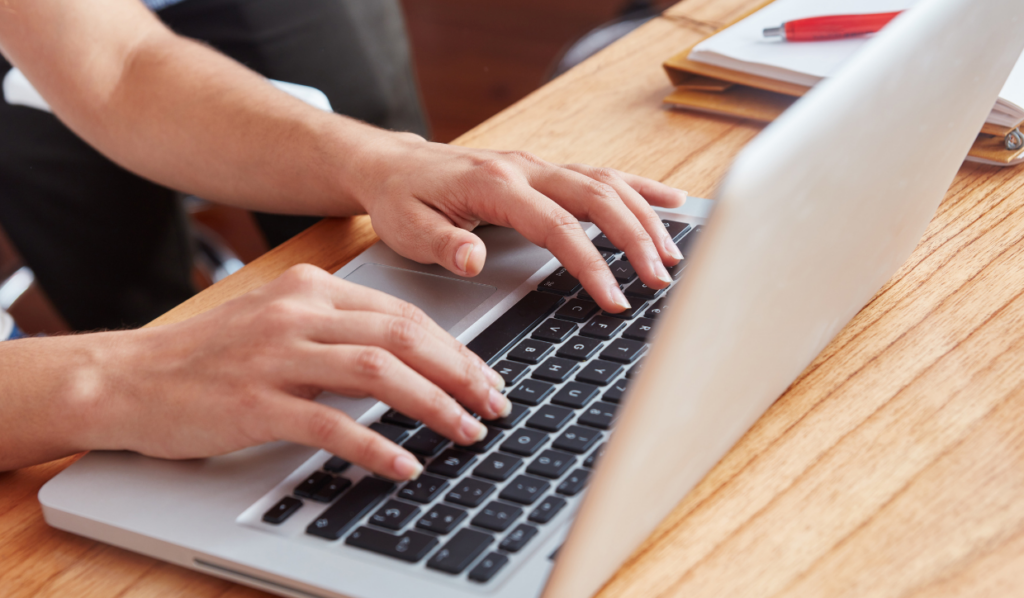 an IT service technician assessing a laptop